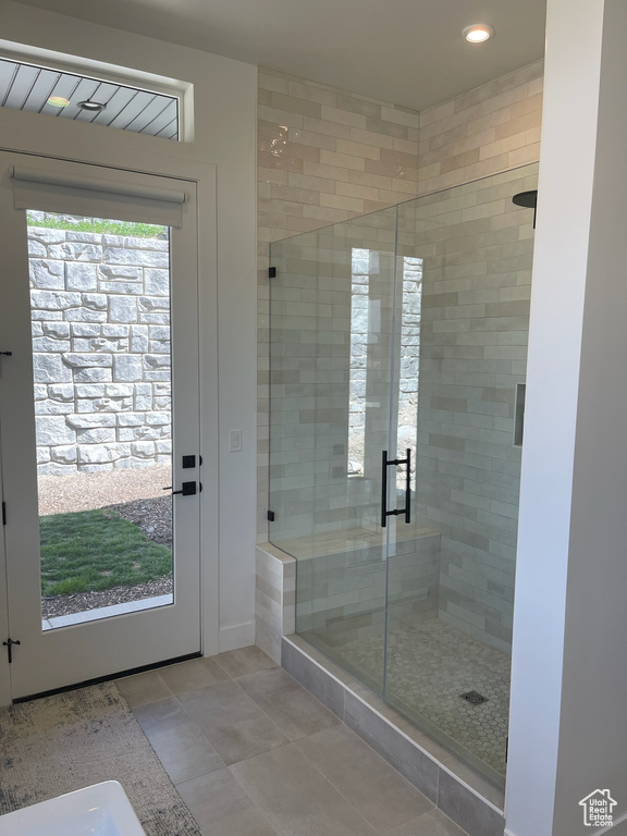 Bathroom featuring recessed lighting, a stall shower, and tile patterned flooring