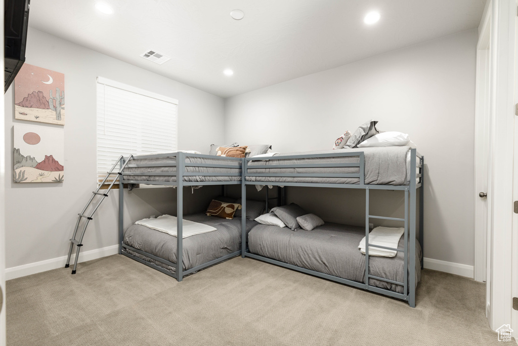 Carpeted bedroom featuring baseboards and recessed lighting