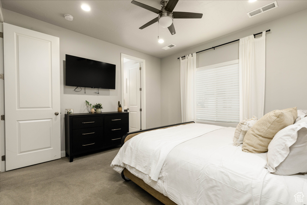 Bedroom featuring light carpet, recessed lighting, and ceiling fan