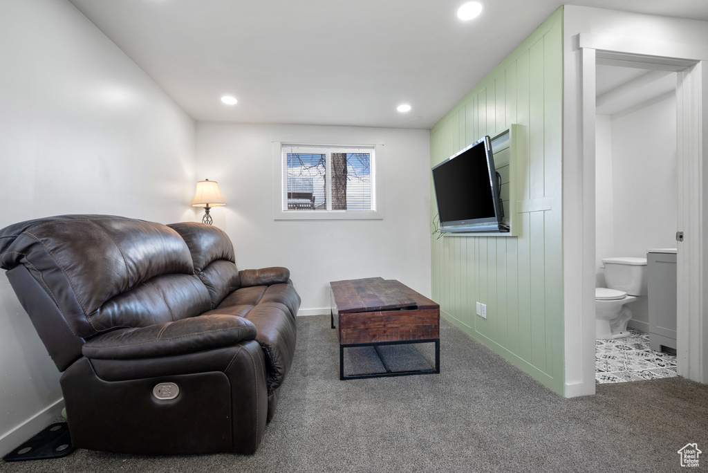 Carpeted living room featuring baseboards and recessed lighting