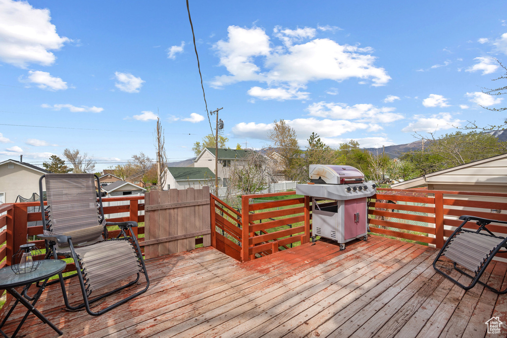 Deck featuring a grill and a mountain view