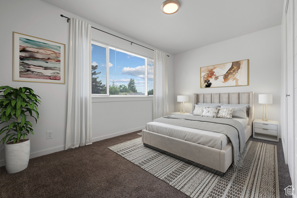 Carpeted bedroom with baseboards