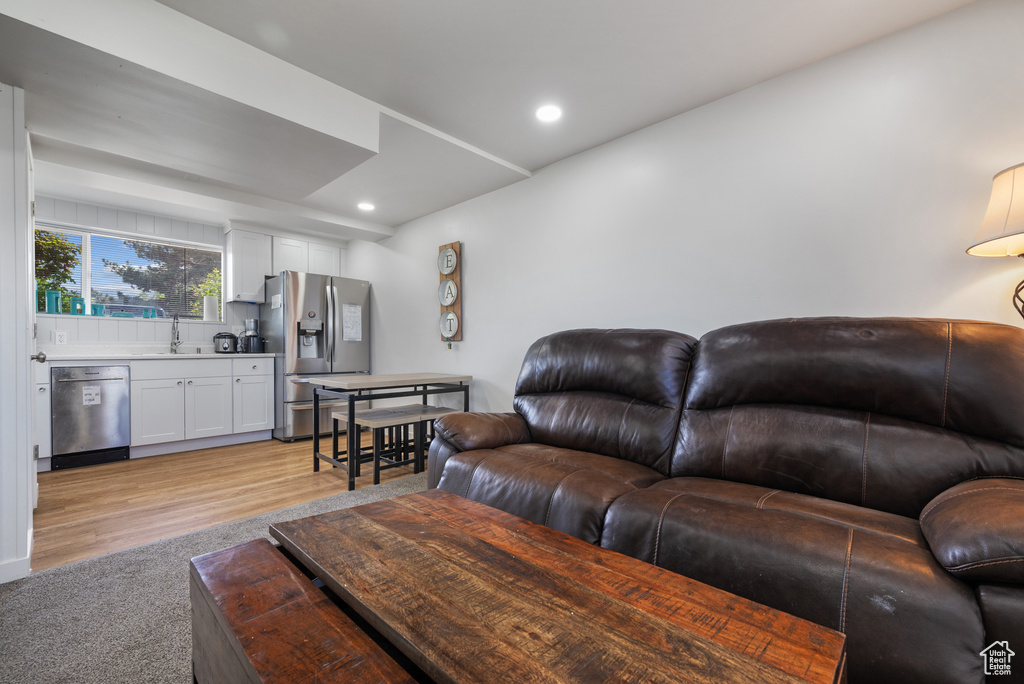 Living area featuring recessed lighting and light wood-style floors