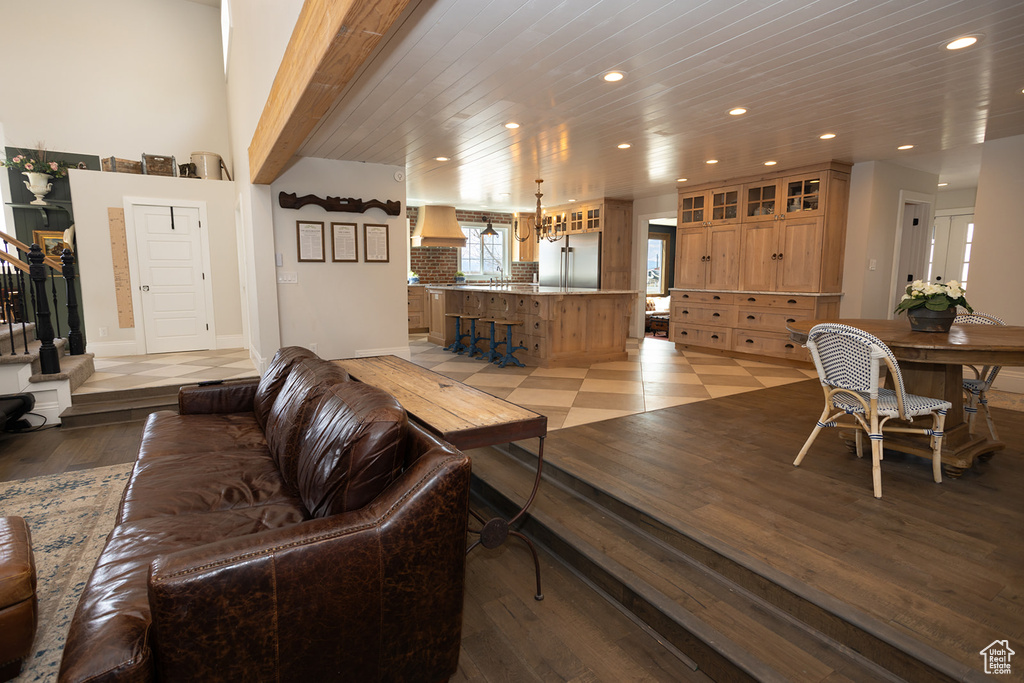 Living area with stairway, wooden ceiling, baseboards, recessed lighting, and light wood finished floors