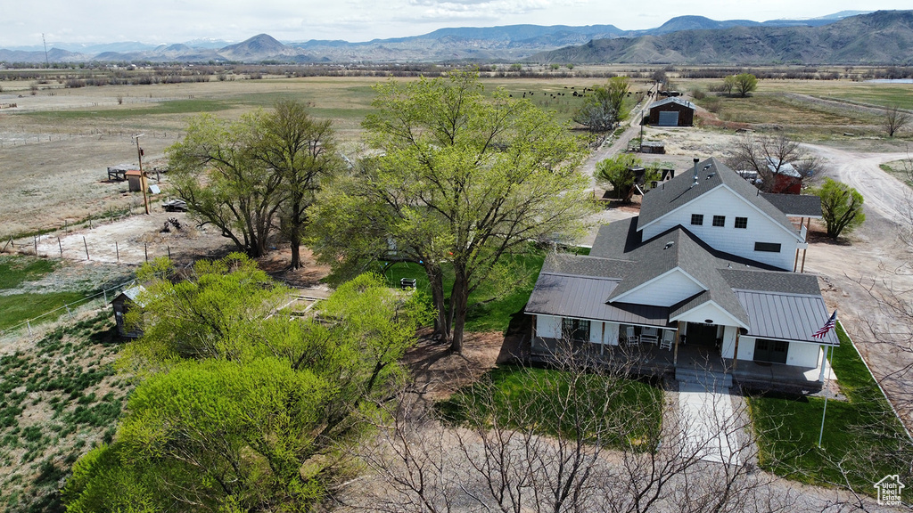 Birds eye view of property featuring a mountain view and a rural view
