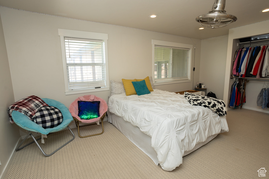 Bedroom featuring recessed lighting, a closet, carpet, and baseboards