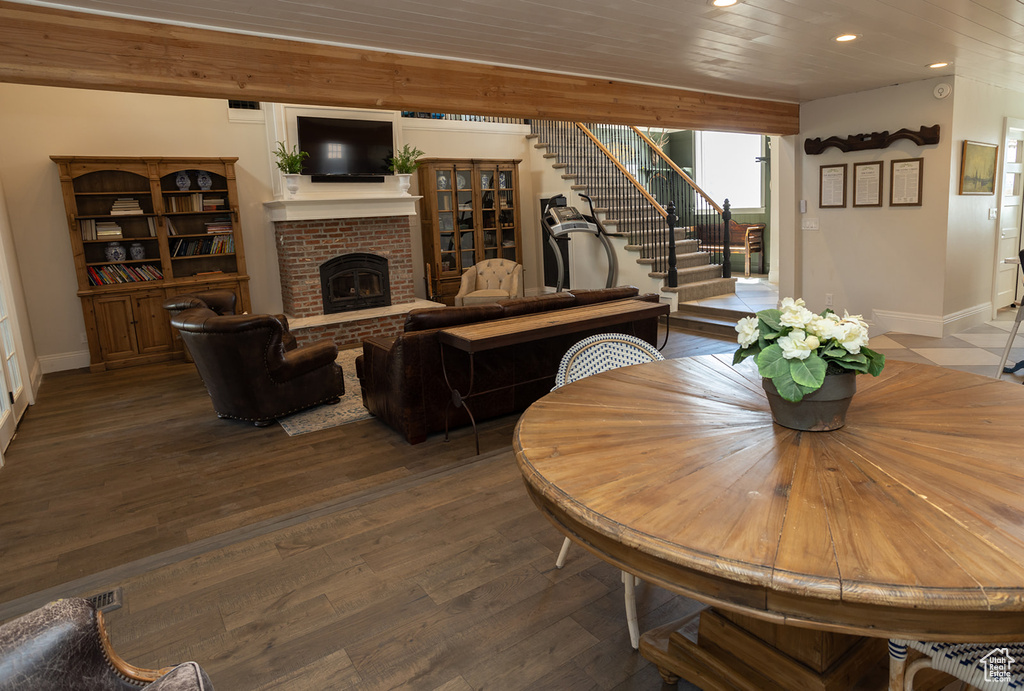 Dining area featuring a fireplace, stairway, recessed lighting, and baseboards