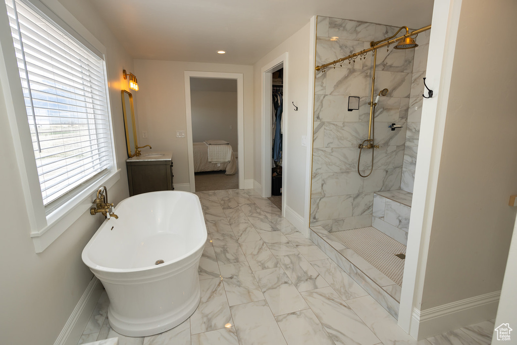 Bathroom with recessed lighting, vanity, a marble finish shower, marble finish floor, and a freestanding bath