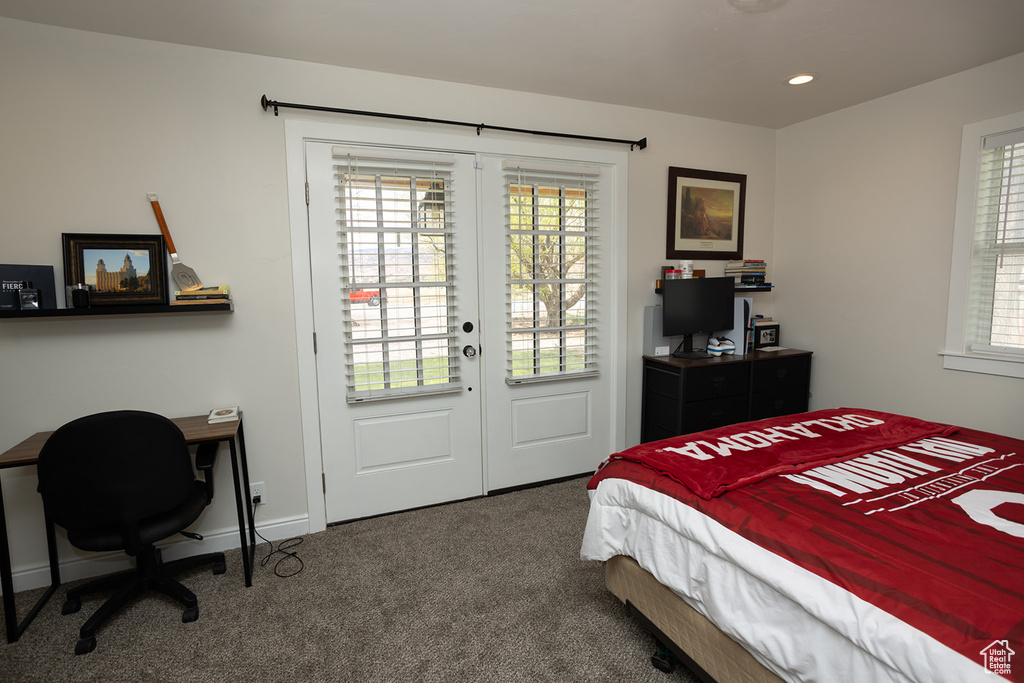 Bedroom featuring baseboards, recessed lighting, french doors, and carpet