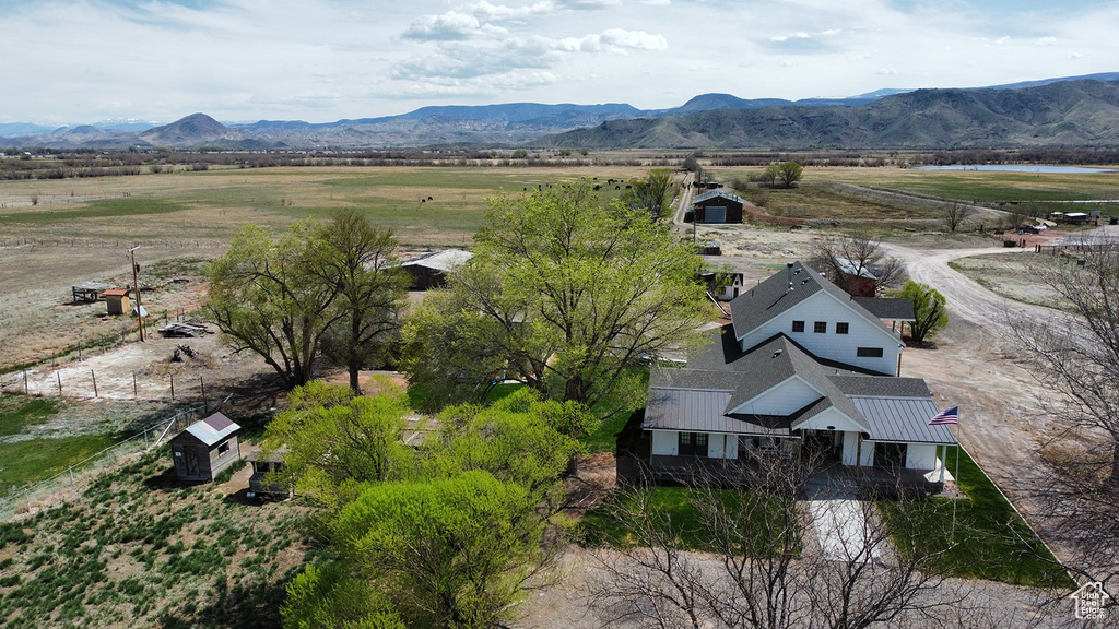 Birds eye view of property featuring a mountain view and a rural view