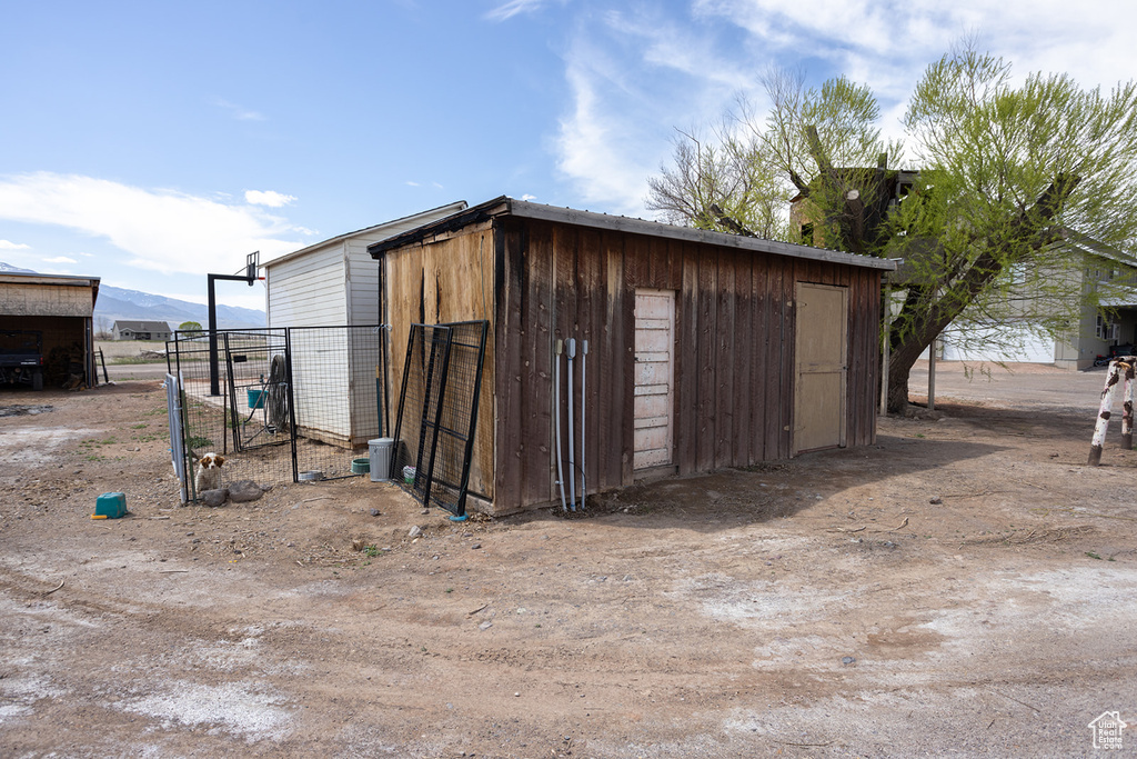 View of outbuilding with an outdoor structure