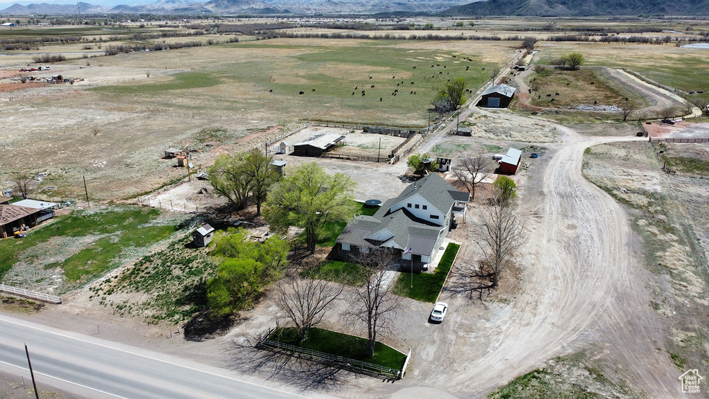 Birds eye view of property with a mountain view and a rural view