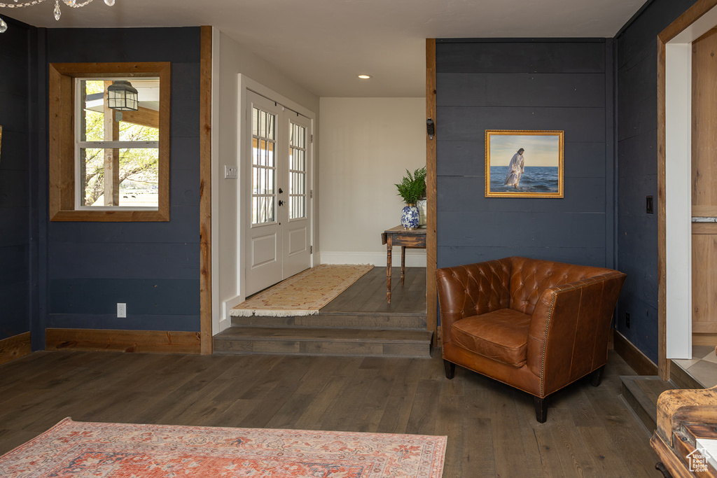 Entryway with wood finished floors, recessed lighting, and baseboards