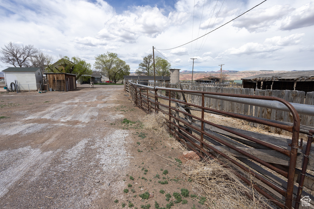 View of street featuring dirt driveway