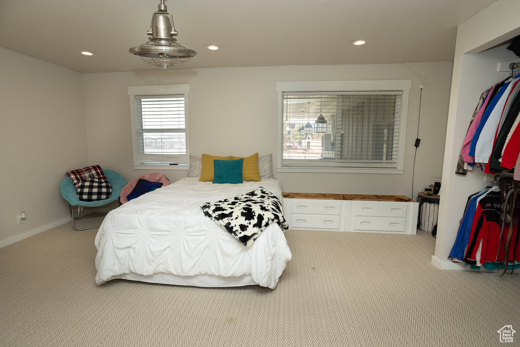 Carpeted bedroom featuring recessed lighting and baseboards