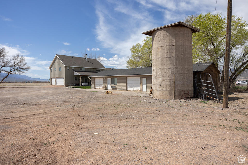 Back of property with driveway