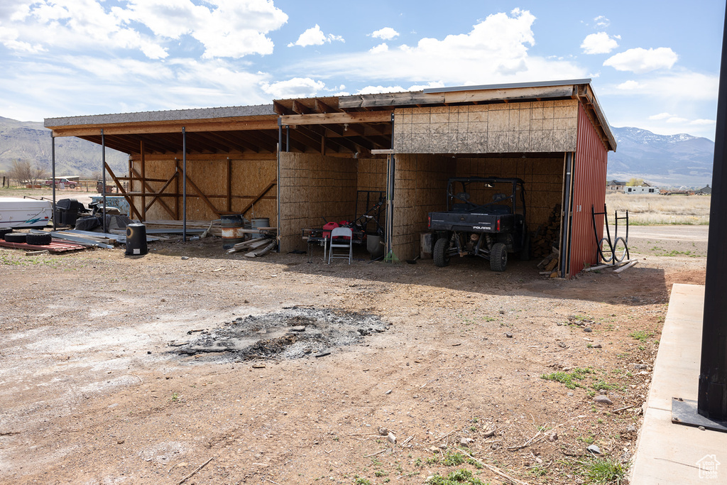 View of pole building featuring a mountain view and a detached carport