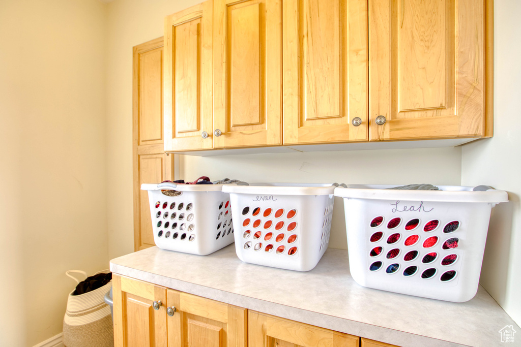 Laundry area featuring baseboards