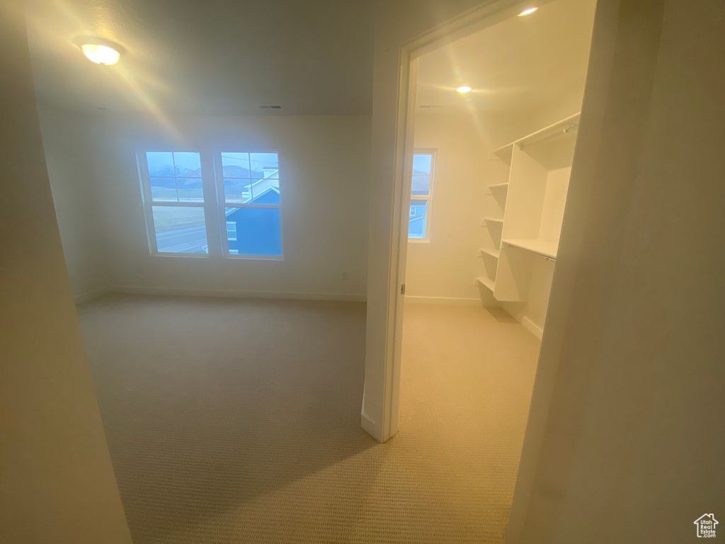 Interior space with baseboards and a wealth of natural light
