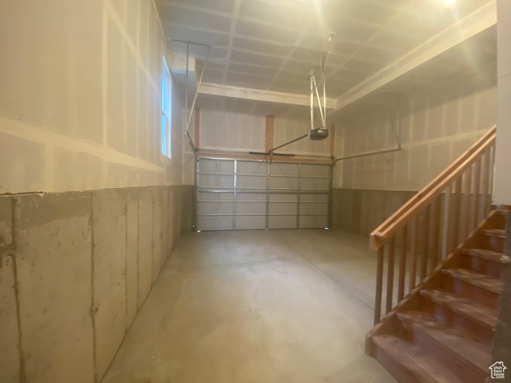 Garage featuring a garage door opener
