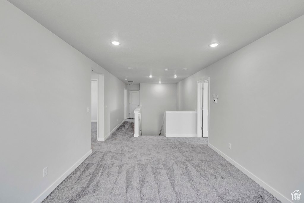 Basement featuring recessed lighting, baseboards, and carpet