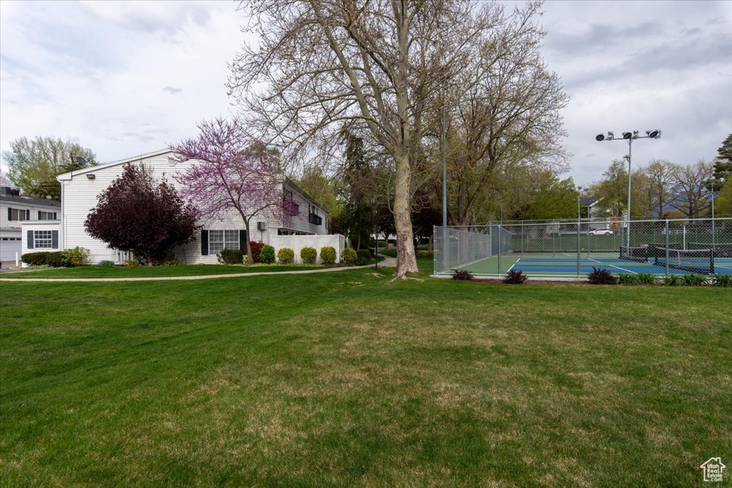 View of yard featuring fence