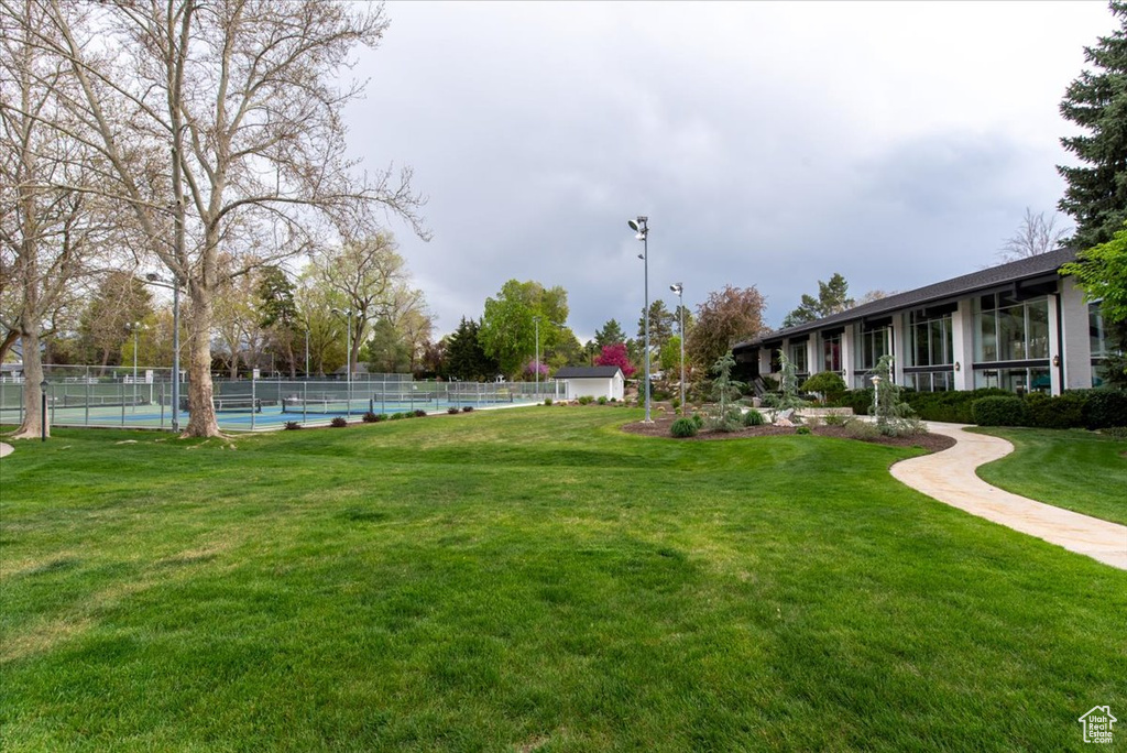 View of yard with a fenced in pool and fence