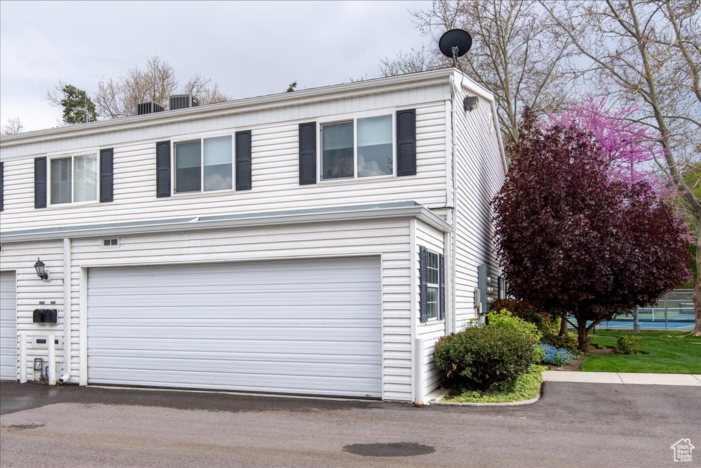Exterior space featuring central AC and a garage