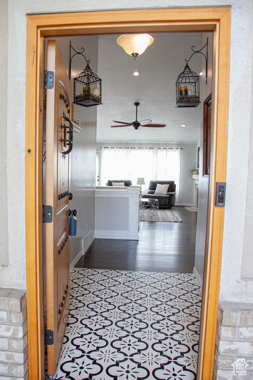 Hallway with baseboards and recessed lighting