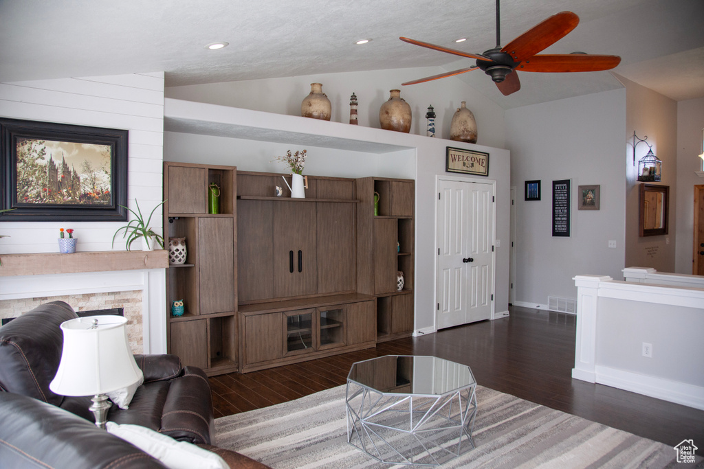 Living area featuring recessed lighting, baseboards, visible vents, a ceiling fan, and dark wood-type flooring