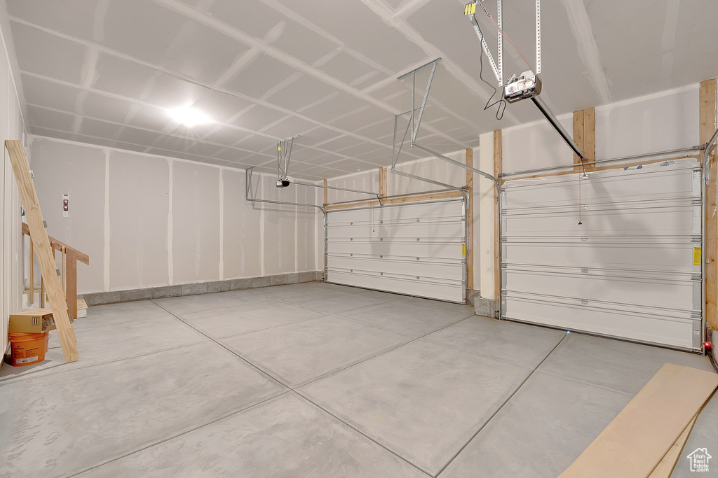 Garage featuring a garage door opener
