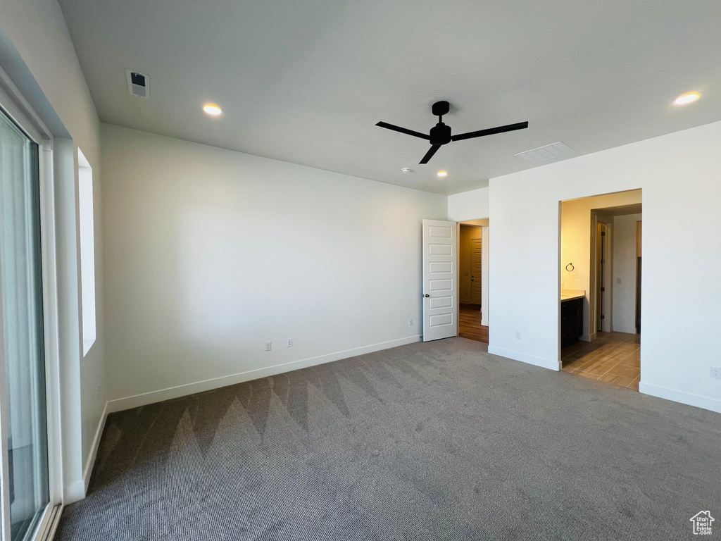 Unfurnished bedroom with visible vents, recessed lighting, and carpet floors