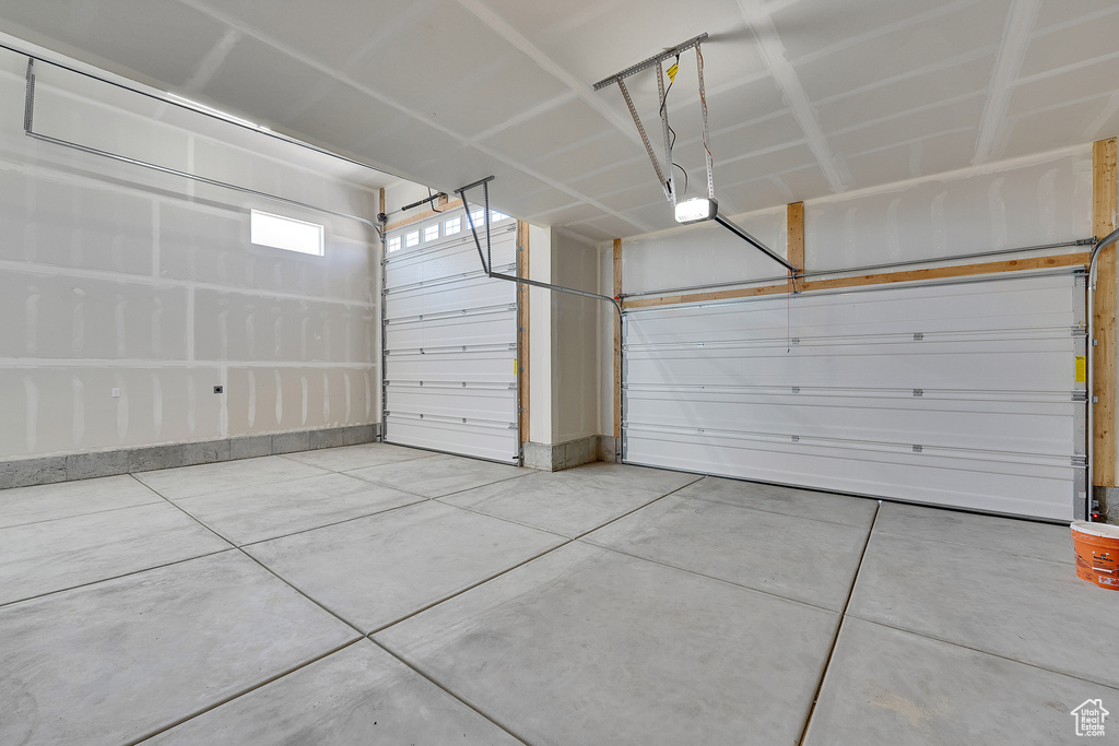 Garage featuring a garage door opener