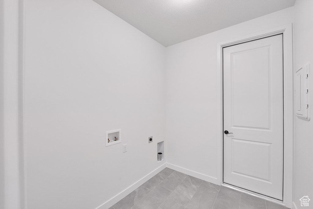 Laundry room with electric dryer hookup and hookup for a washing machine