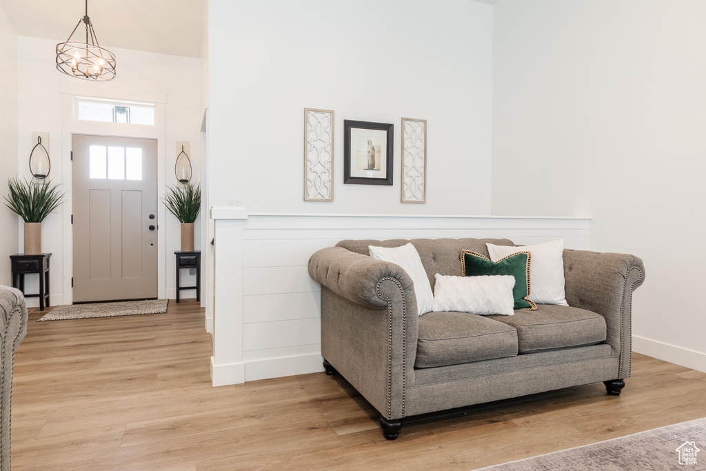 Foyer featuring baseboards and light wood-style flooring