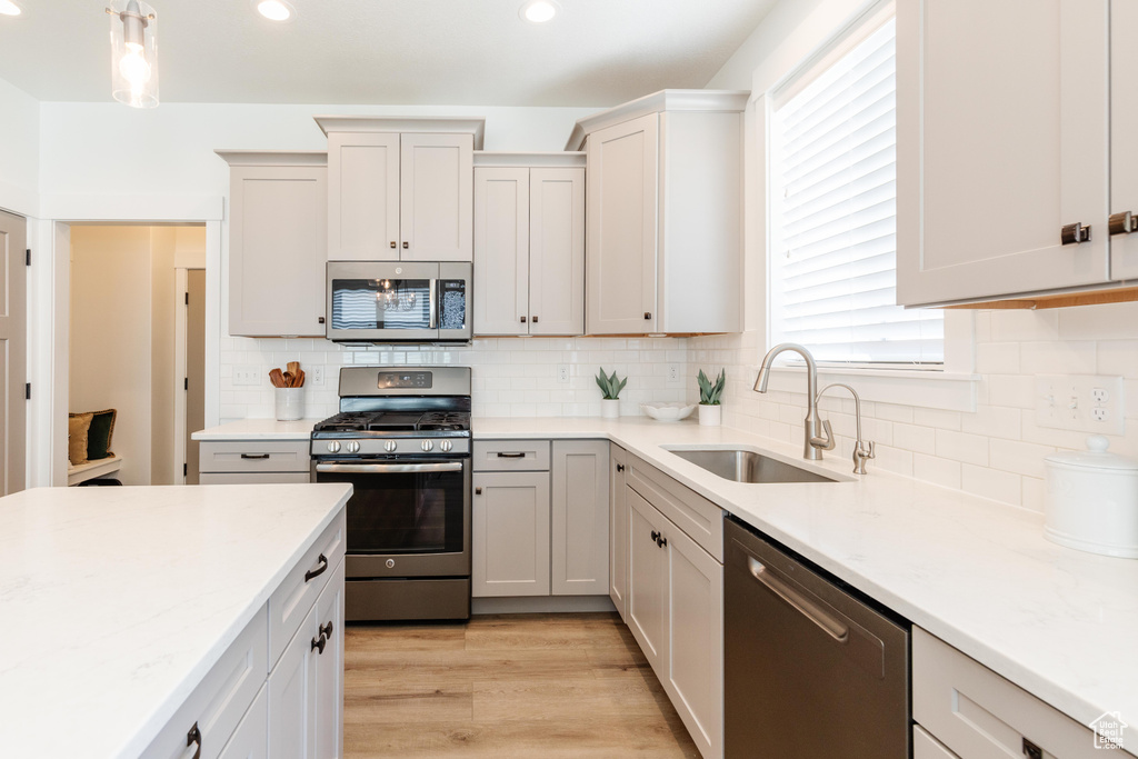 Kitchen featuring a sink, appliances with stainless steel finishes, plenty of natural light, and recessed lighting