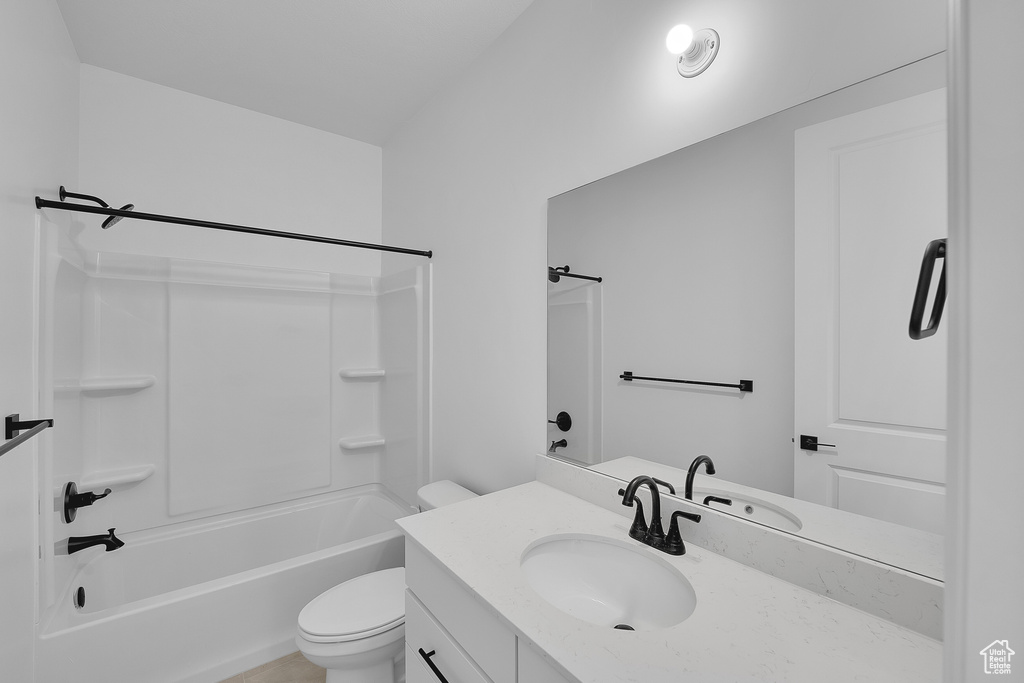 Full bath featuring vanity and bathing tub / shower combination