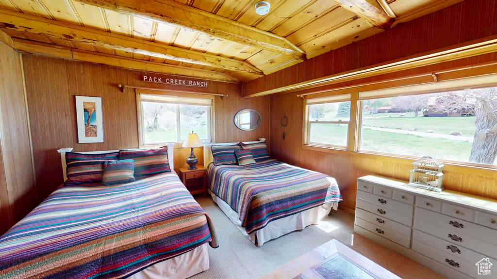Bedroom featuring wood walls and wood ceiling