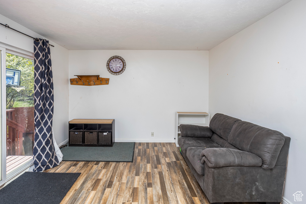 Living area featuring wood finished floors and baseboards