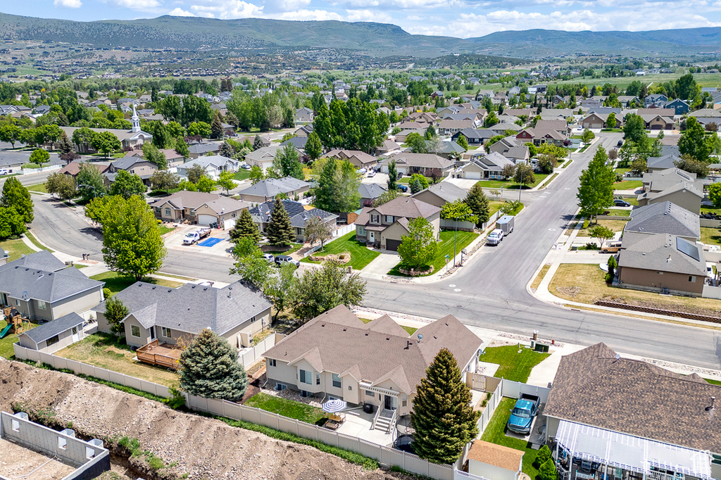 Aerial view of residential area with a mountain backdrop