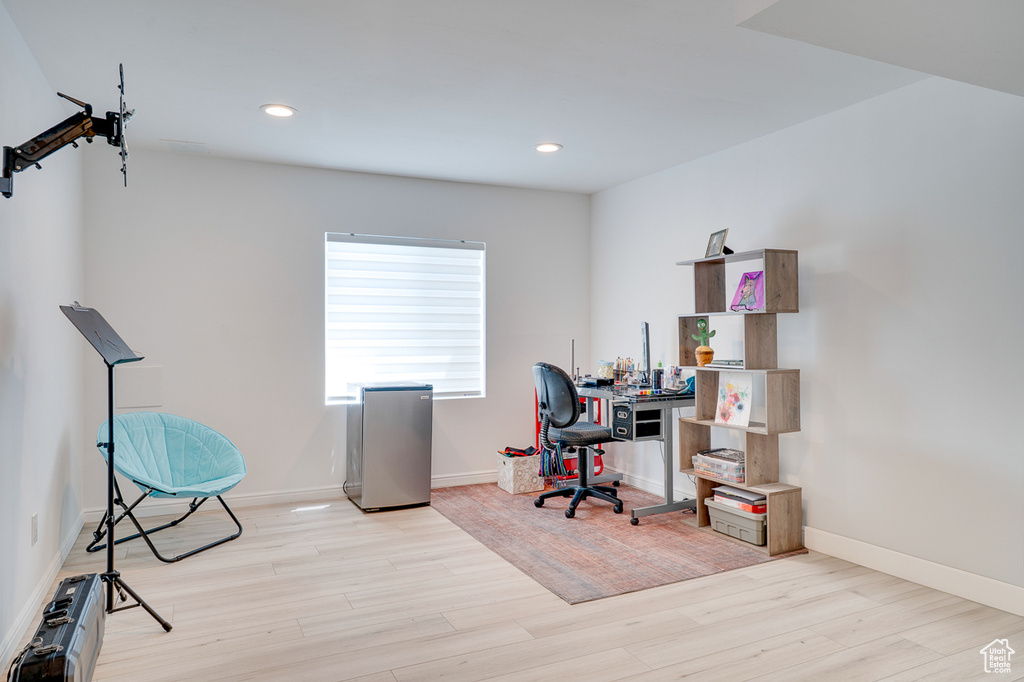 Office featuring wood finished floors, recessed lighting, and baseboards