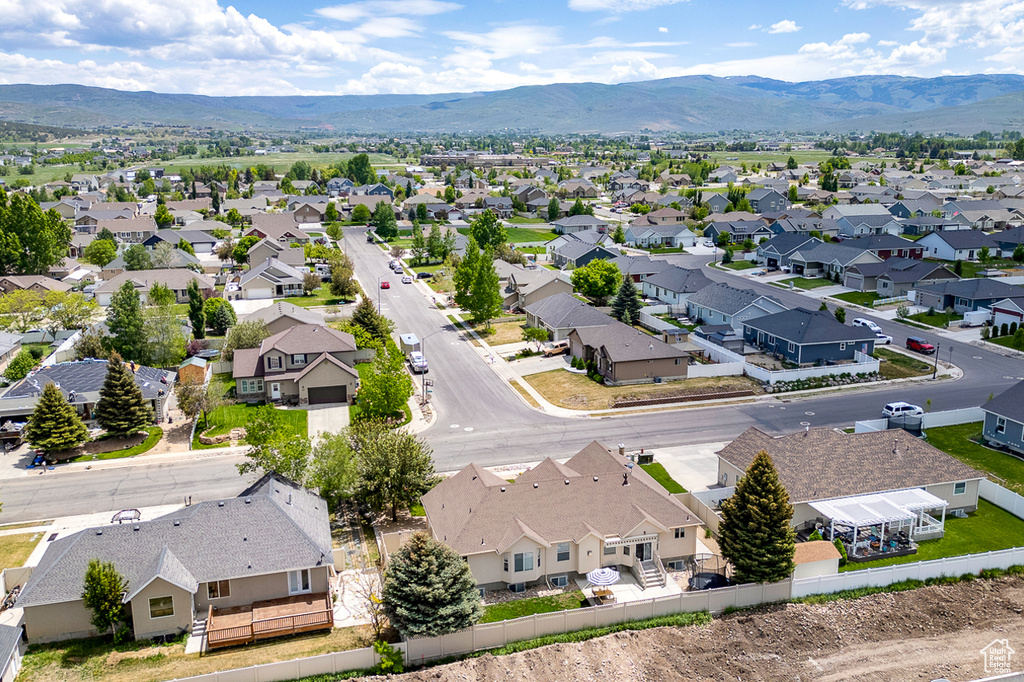 Aerial view of residential area with a mountainous background