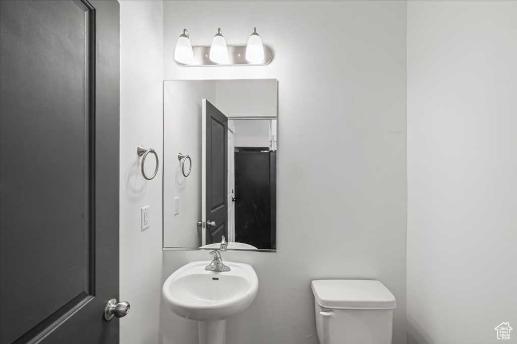 Bathroom featuring toilet and a sink