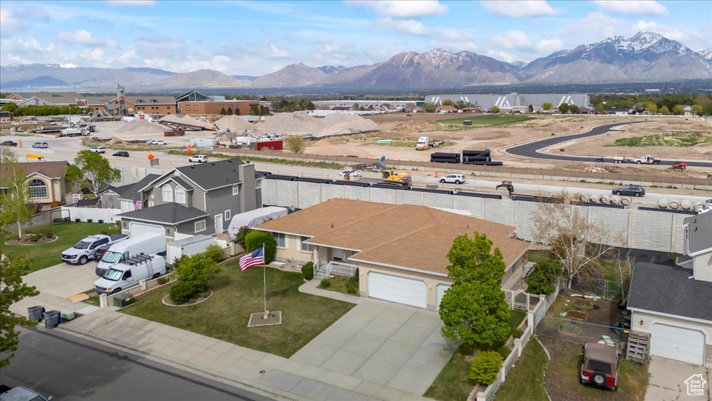 Drone / aerial view with a residential view and a water and mountain view