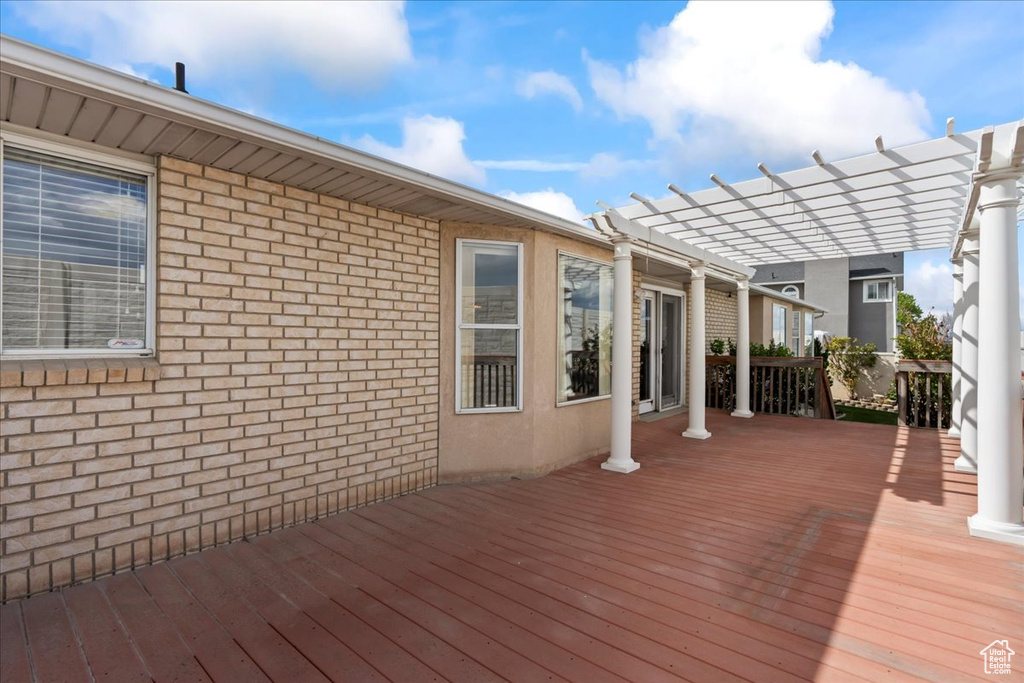 Deck featuring a pergola