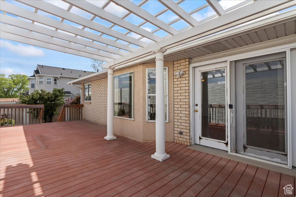 Deck featuring a pergola