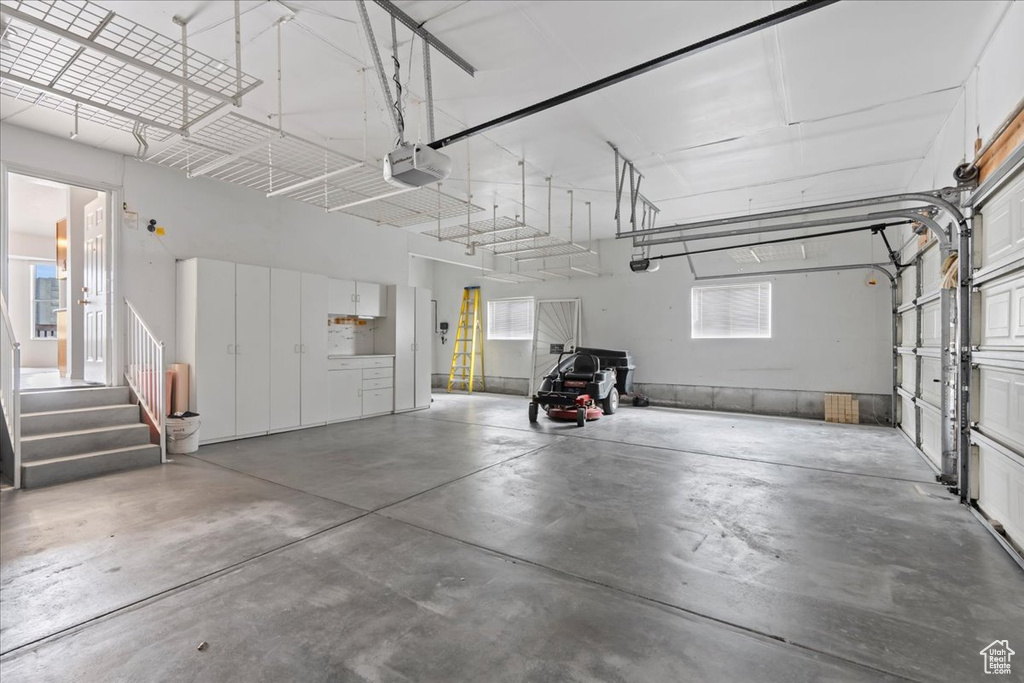 Garage featuring a garage door opener