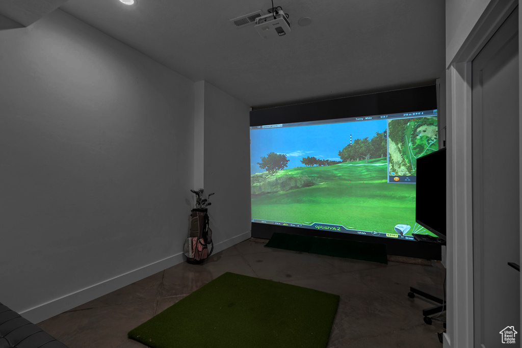 Game room featuring baseboards, recessed lighting, and golf simulator