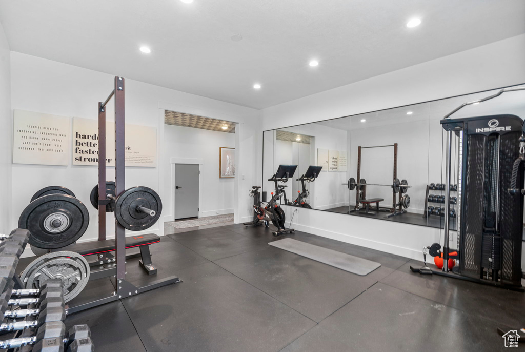 Exercise room featuring recessed lighting and baseboards