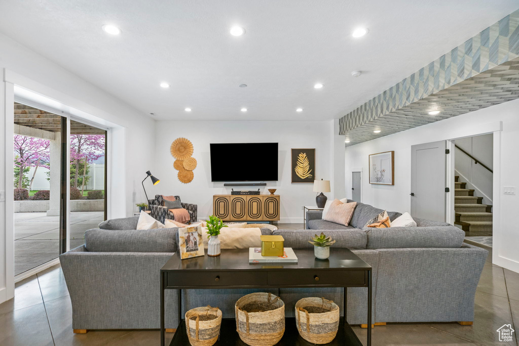 Living area featuring recessed lighting and stairs